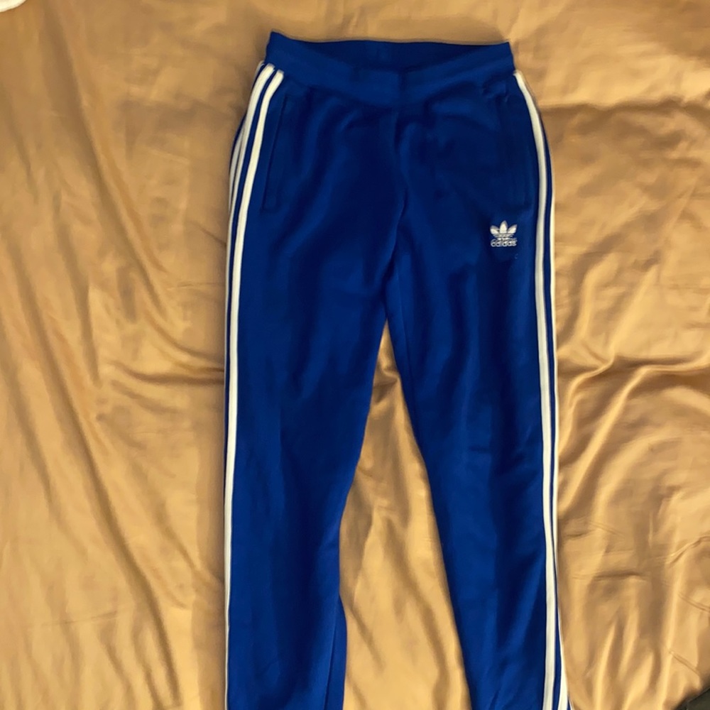 Blue/white Adidas track pants